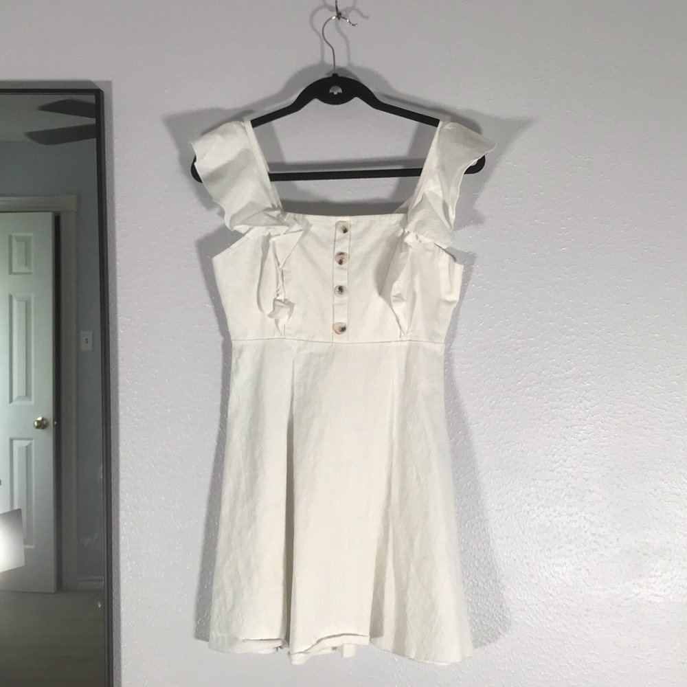 Linen white mini dress w/ ruffle and button detail